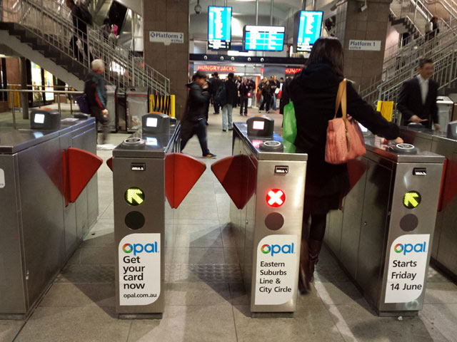 Opal readers and displays come in several styles. This style is stuck on top of existing ticket gates.